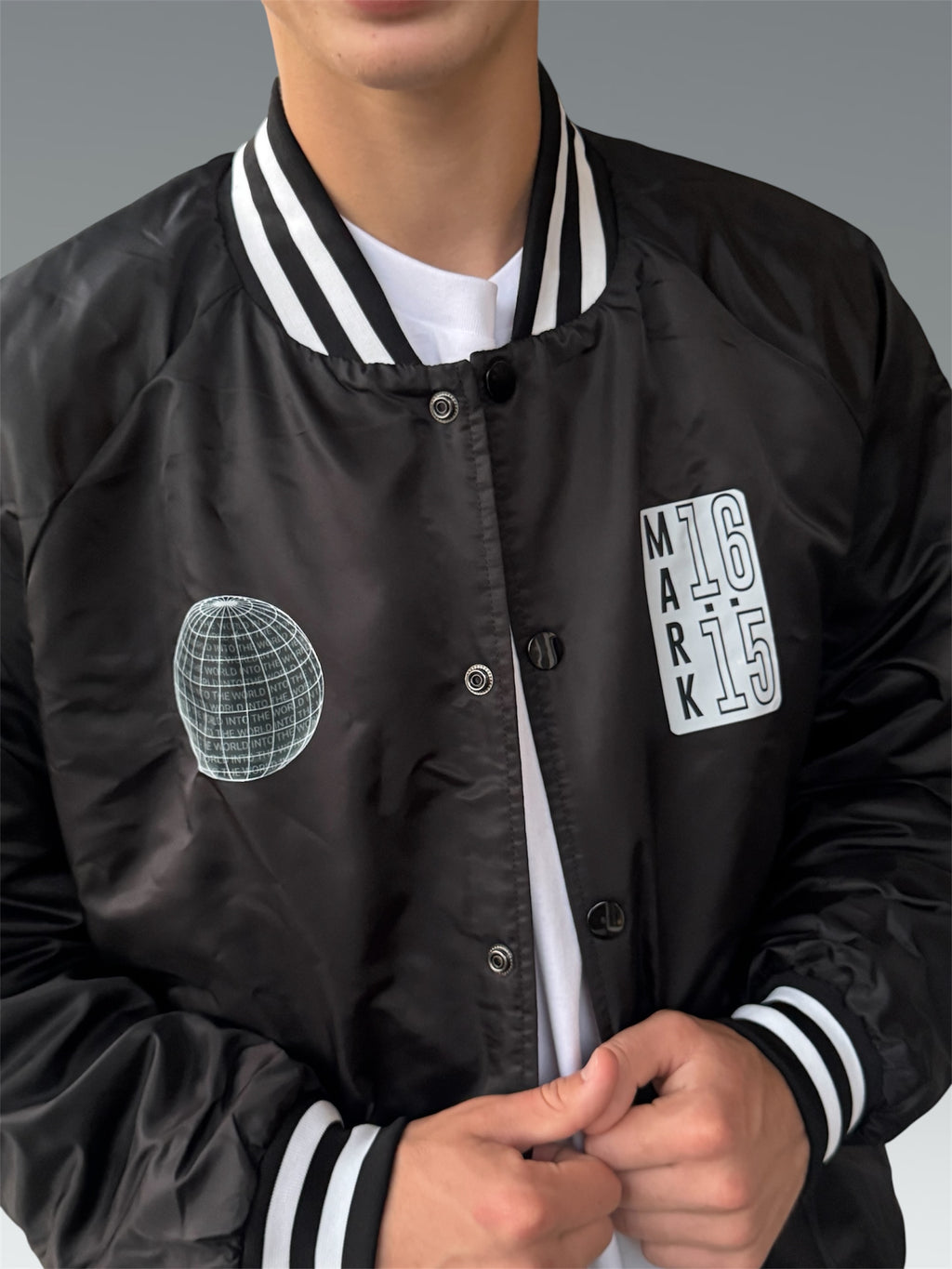 INTO THE WORLD VARSITY BOMBER JACKET