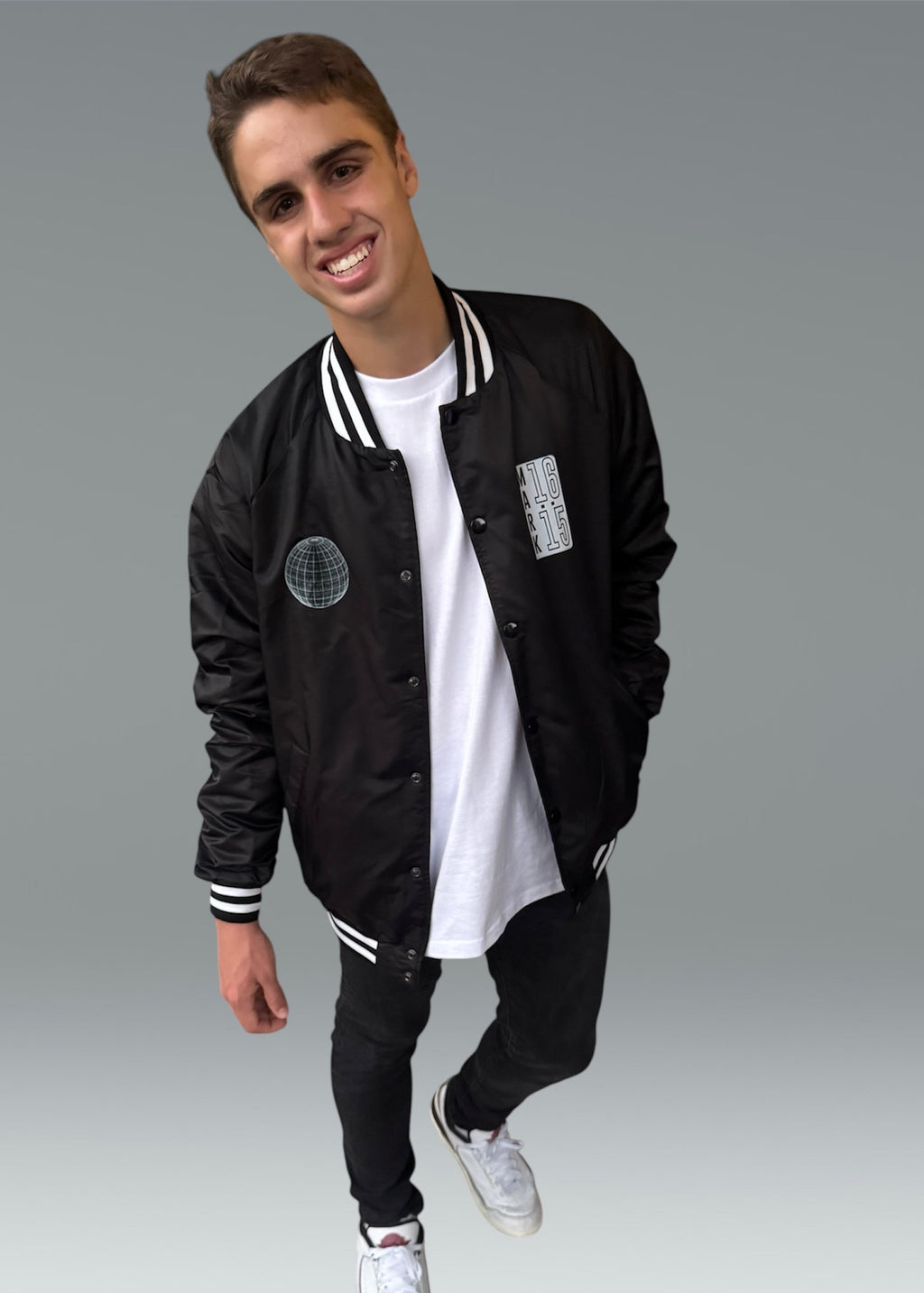 INTO THE WORLD VARSITY BOMBER JACKET